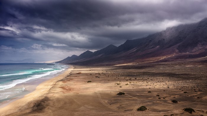 Fuerteventura coast with mountains and stormy sky