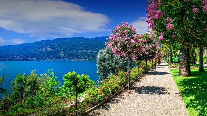Garden path overlooking a lake and mountains