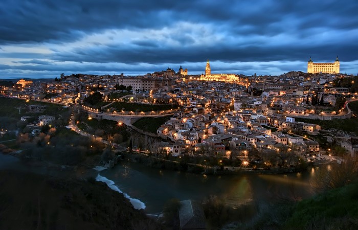 Toledo cityscape at dusk with river