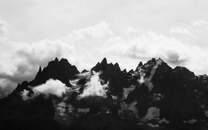 Monochrome mountains with clouds and snow