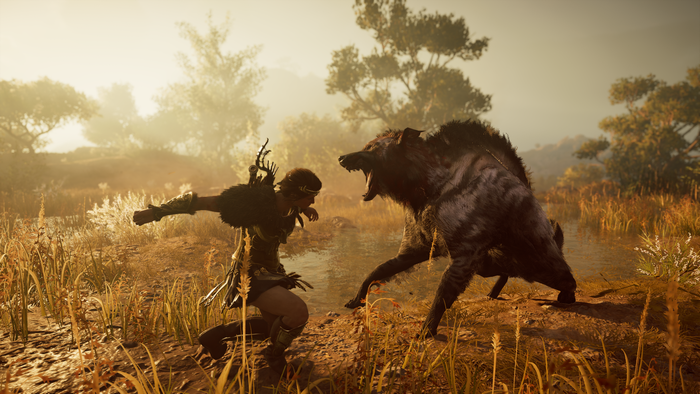 Kassandra fighting a wolf in Assassin's Creed Odyssey