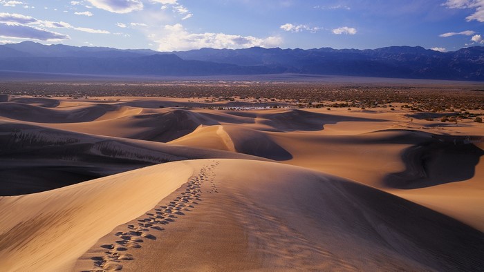 Footprints on sand dunes in Death Valley, California
