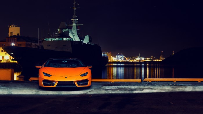 4K Orange Lamborghini Huracan by Warship at Night
