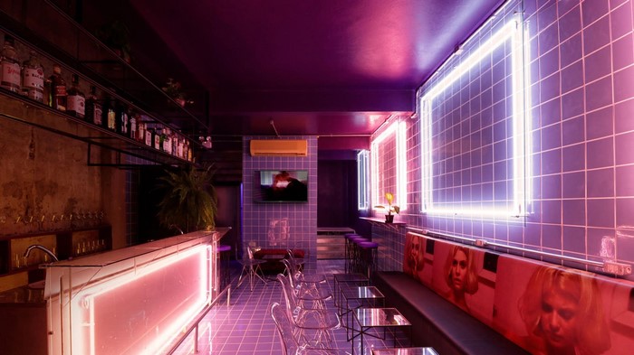 Modern bar interior with neon lights and purple tiles