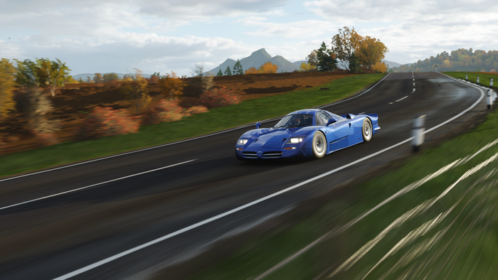 Blue racing car on a road in Forza Horizon 4