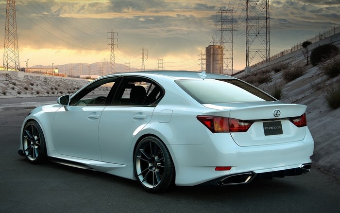 White Lexus GS F sedan on a road
