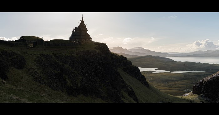Viking temple on a cliff overlooking a lake