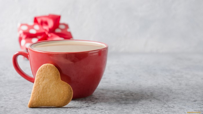 Red mug with heart cookie and gift