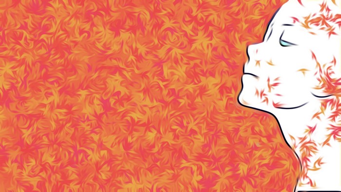 Woman's face with orange floral pattern