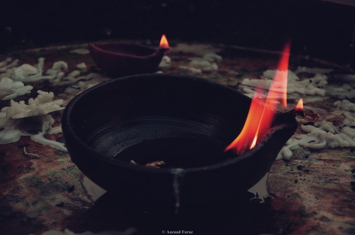 Burning oil lamps with melted candles