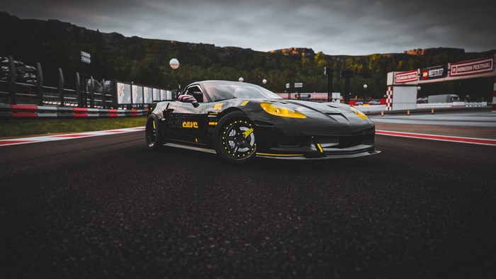 Black Chevrolet Corvette C6 on a race track
