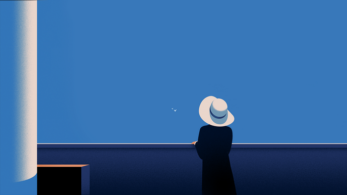 Person in hat looking at seagulls