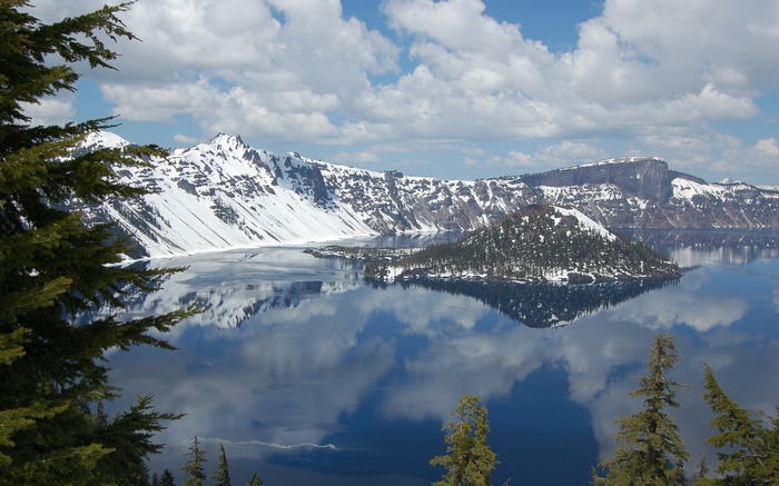 Crater Lake with Wizard Island and snow-capped mountains