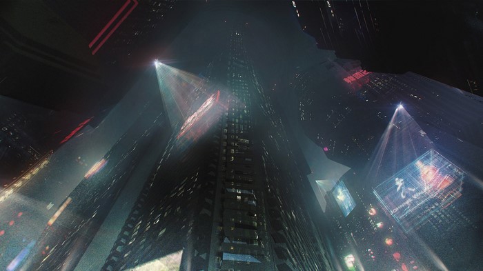 Futuristic cityscape at night with skyscrapers and holograms