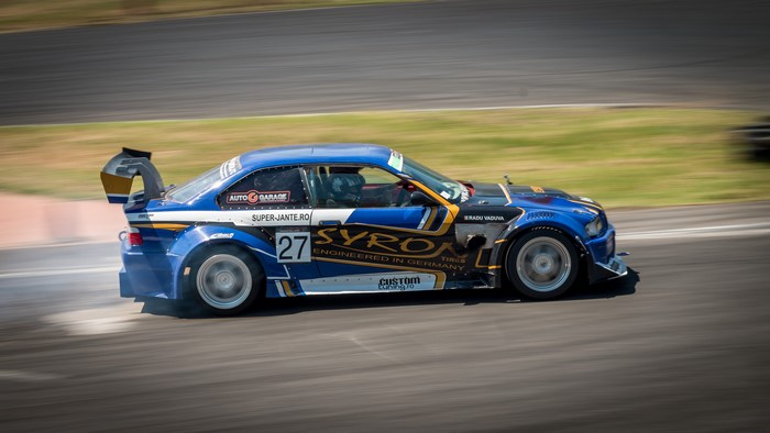 BMW drift car with number 27 on racetrack