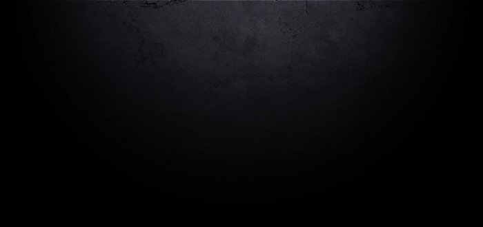 Dark textured surface with subtle lighting