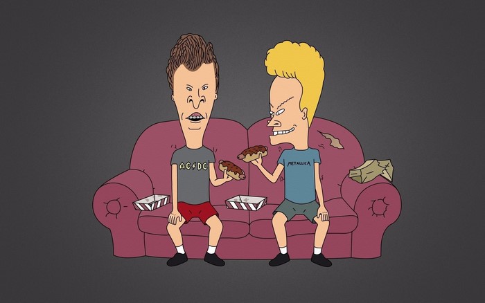 Beavis and Butt-Head sitting on a couch eating hot dogs