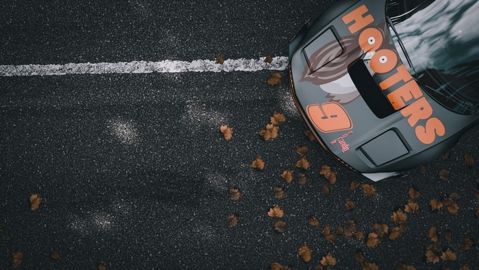 Honda NSX mk1 with Hooters livery on asphalt