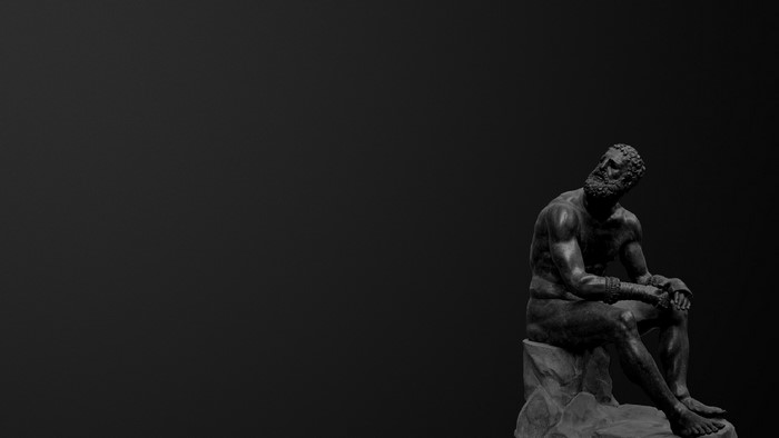 Seated boxer statue