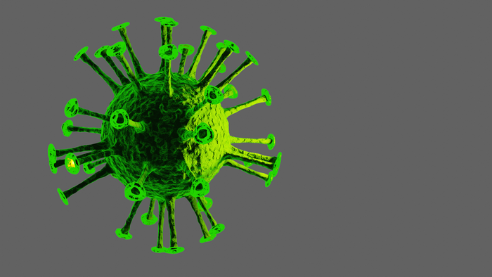 Green virus particle with spikes on gray background