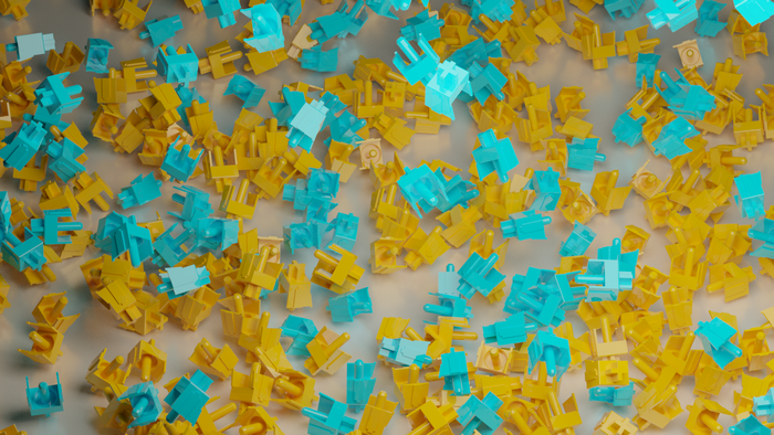 Scattered blue and yellow keyboard switch stems