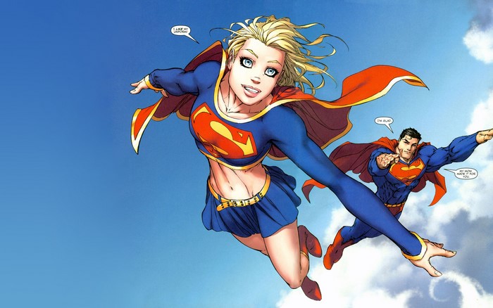 Supergirl and Superman flying in the sky