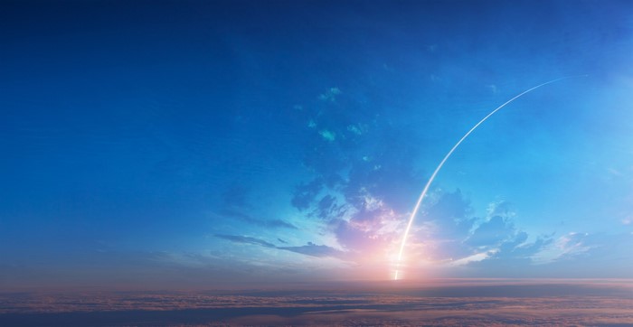 Rocket Launch Trail in a Cloudy Sky