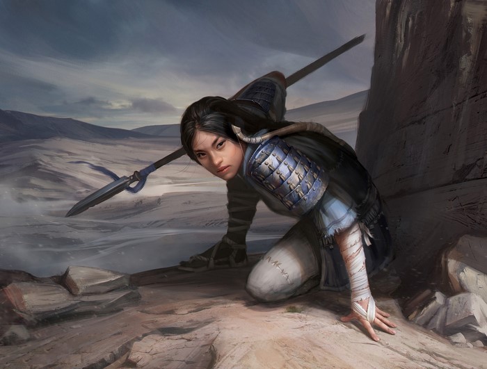 Asian warrior girl with spear in a desert landscape