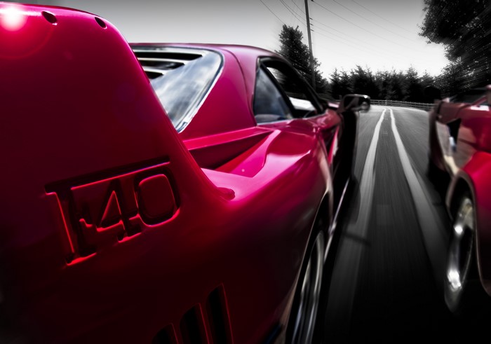Ferrari F-40 driving on a road