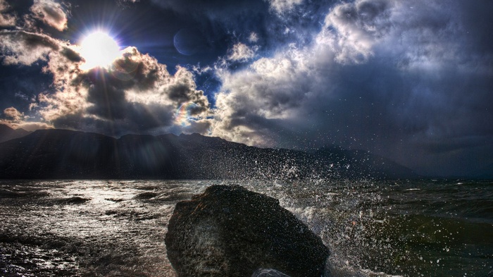 Stormy Sky Over Rocky Shoreline with Waves