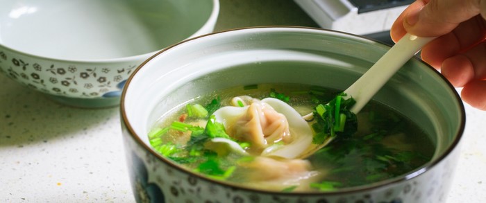 Chinese wonton soup with herbs