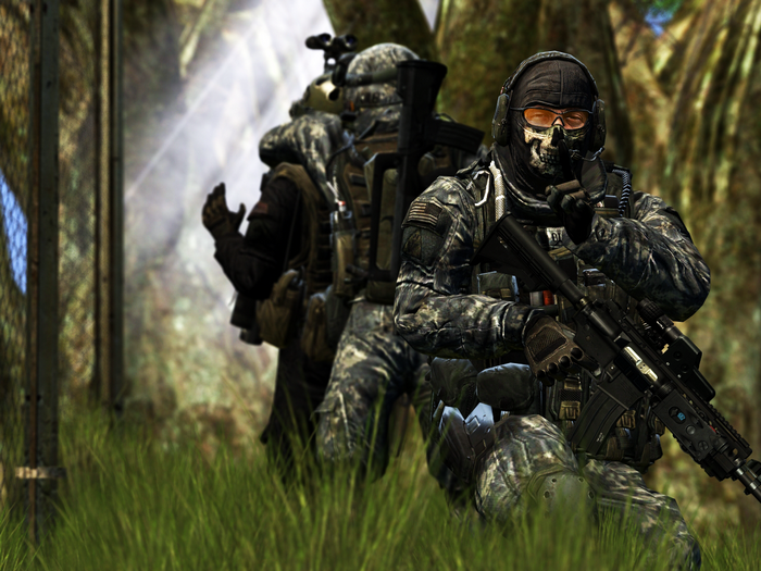 Soldiers in camouflage gear in a forest