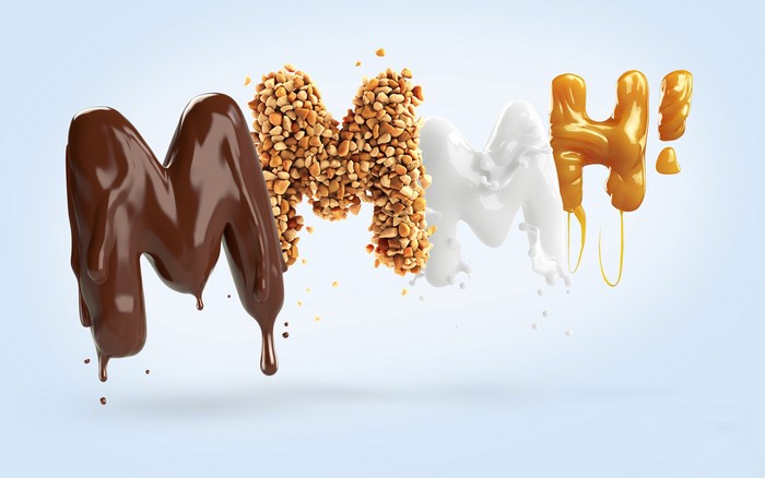 4K typography of M with chocolate, nuts, milk, and caramel