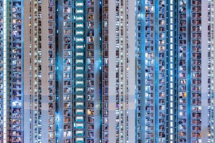 High-rise apartment buildings with illuminated windows in Hong Kong