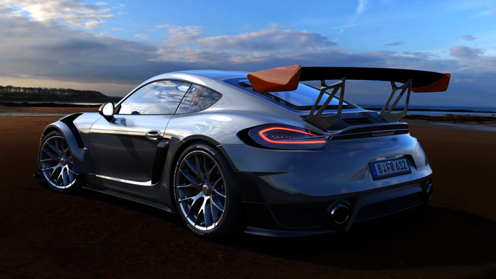 Porsche Cayman GT4 with large rear wing on beach