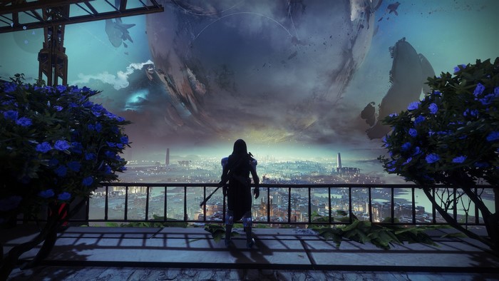 Guardian overlooking a city with a planet in Destiny 2