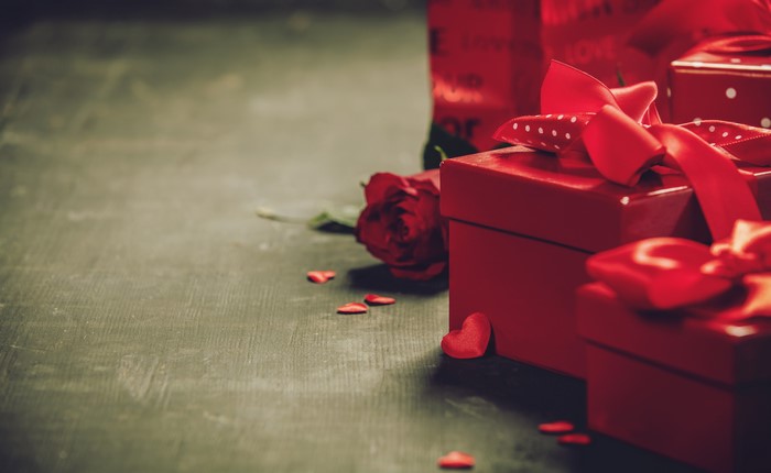 Red gift boxes and rose with hearts