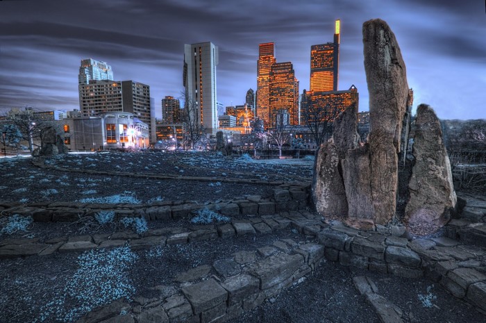 Cityscape with large rocks in the foreground
