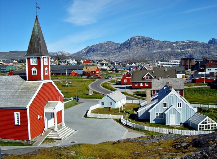 Red church in Nuuk, Greenland with mountains