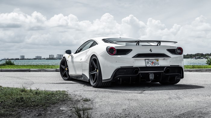 White Ferrari 488 GTB by the water