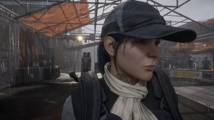Woman with blue hair wearing a baseball cap in The Division 2
