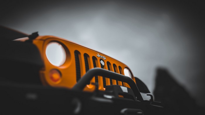 Orange Jeep Wrangler grille and headlights