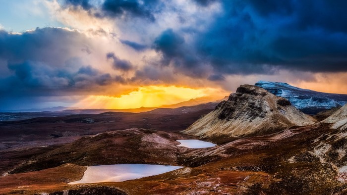 Sunset over mountains and lakes in Scotland
