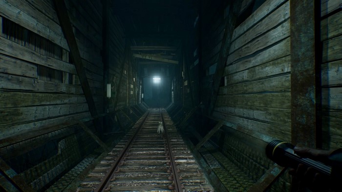 Blair Witch: A dog walks on train tracks in a dark tunnel