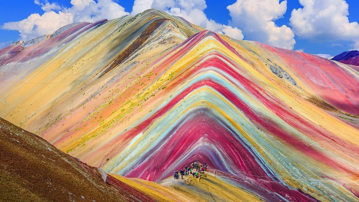 Vinicunca Rainbow Mountain with clouds and sky