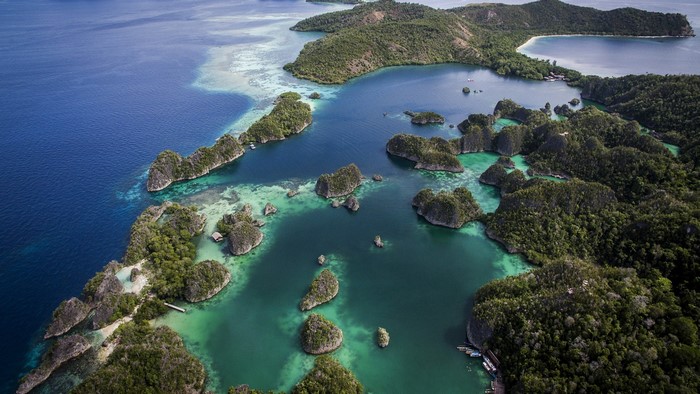 Aerial view of islands with forests and turquoise water