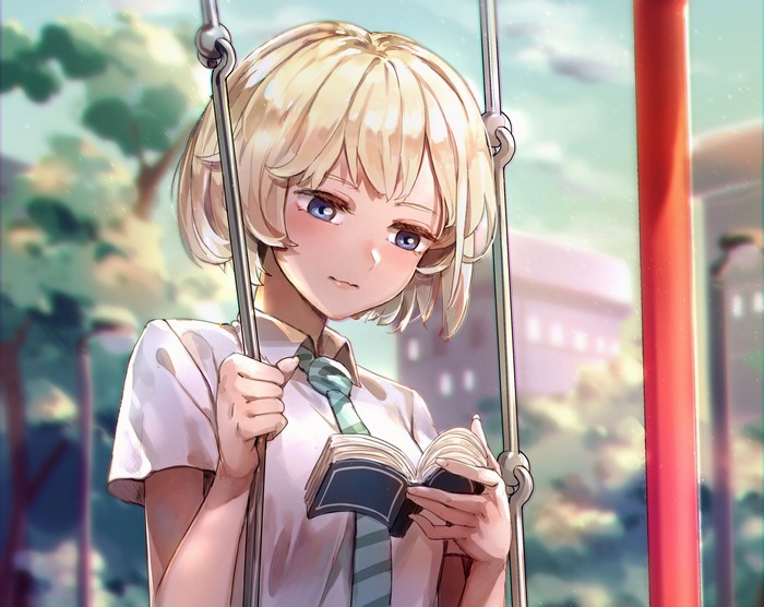 Girl reading a book on a swing