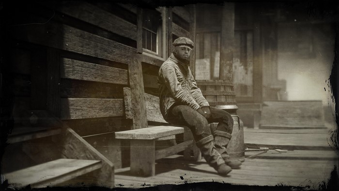 Man sitting on a bench in Red Dead Redemption 2