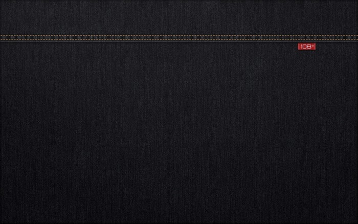 Black denim texture with stitching and label