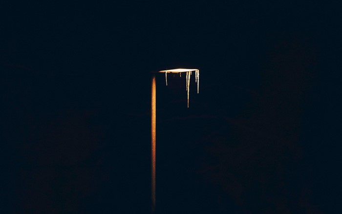 Street light with icicles in the dark